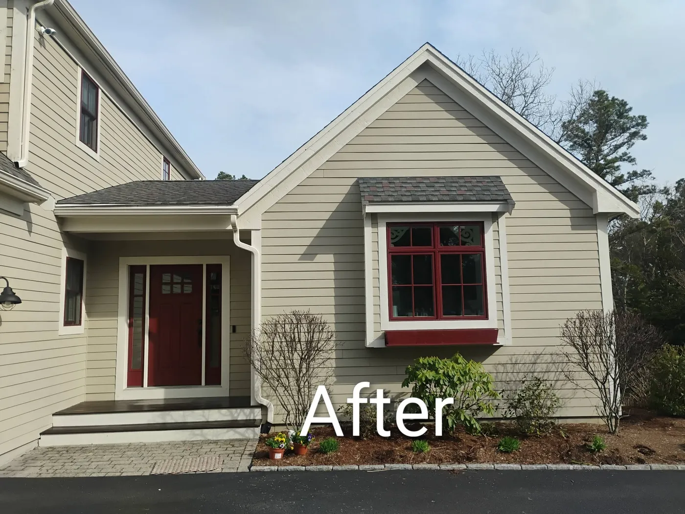 Exterior repaint with refinished entry, after